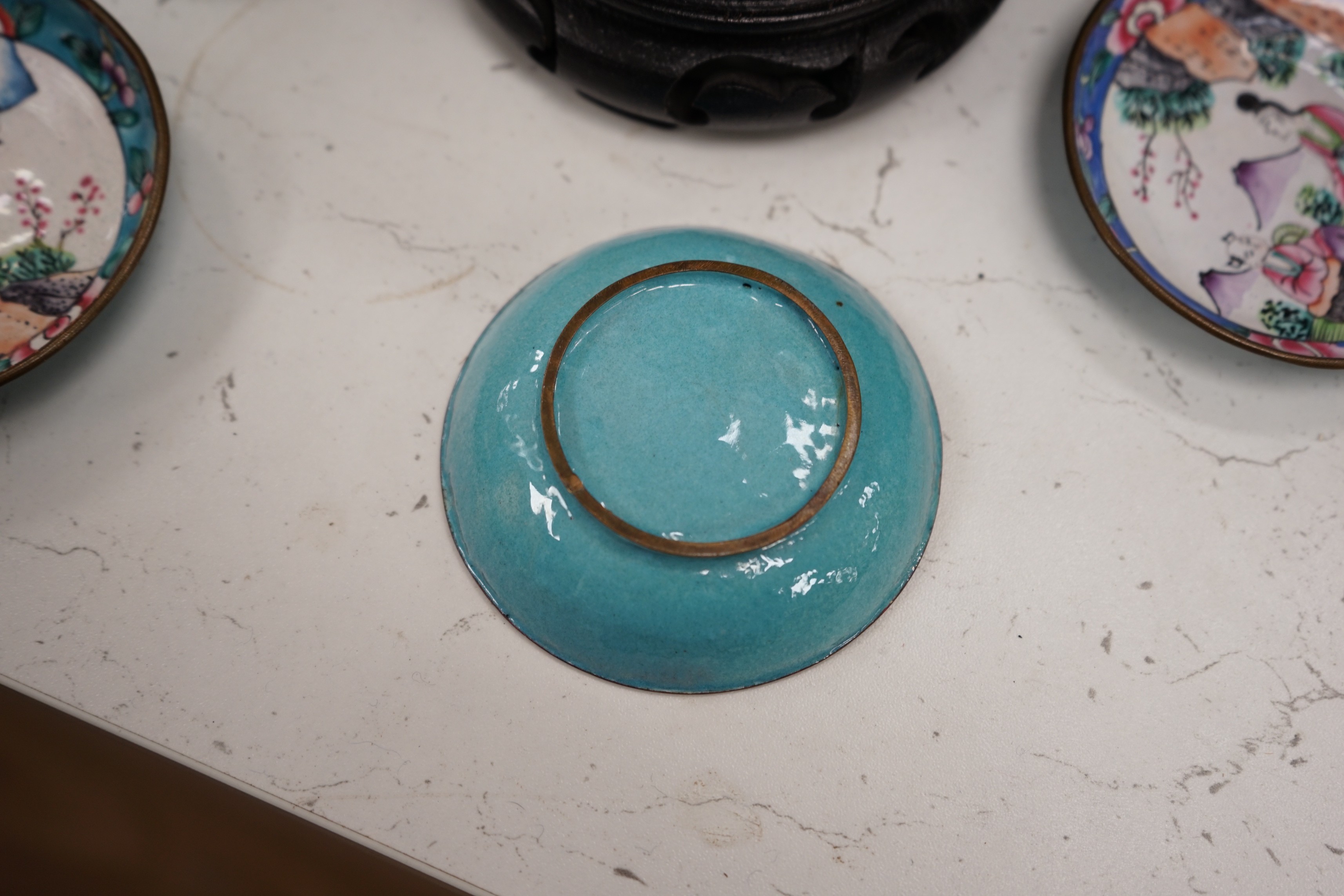 A Chinese cloisonné enamel 'dragon' bowl, six Chinese floral cloisonné enamel bowls and four Canton enamel dishes and wood stands